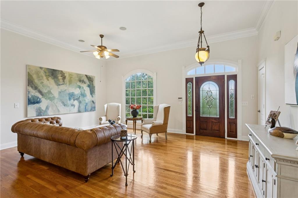 2115 Euharlee Road Taylorsville, GA 30178 - Photo 16 of 66 a living room with furniture chandelier and a wooden floor