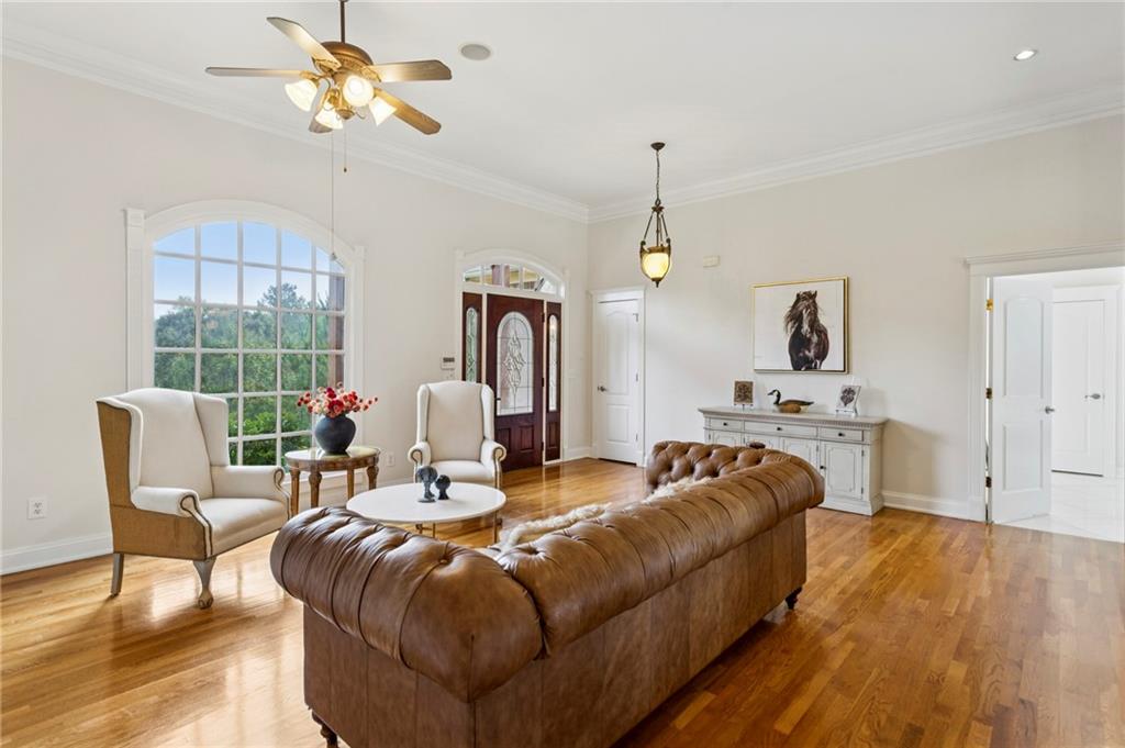 2115 Euharlee Road Taylorsville, GA 30178 - Photo 17 of 66 a living room with furniture a fireplace and a chandelier