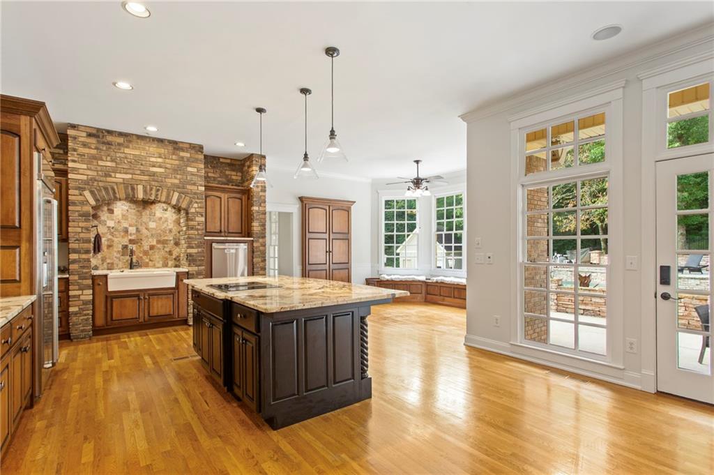 2115 Euharlee Road Taylorsville, GA 30178 - Photo 22 of 66 a kitchen with stainless steel appliances granite countertop a stove and wooden floor