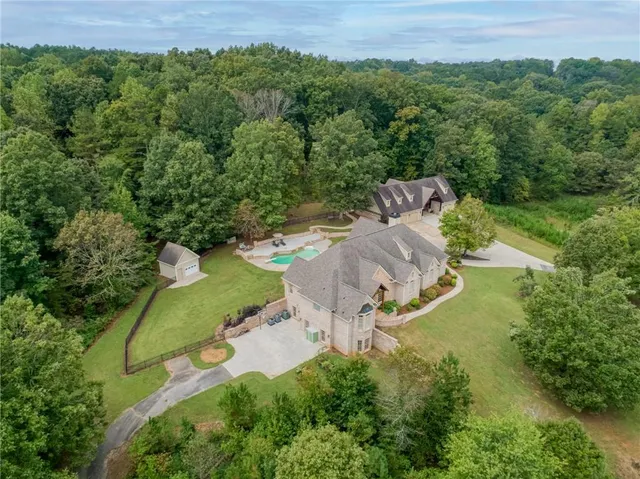 an aerial view of a house with outdoor space and street view