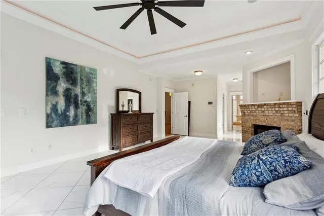 a bathroom with a granite countertop sink a mirror and a shower