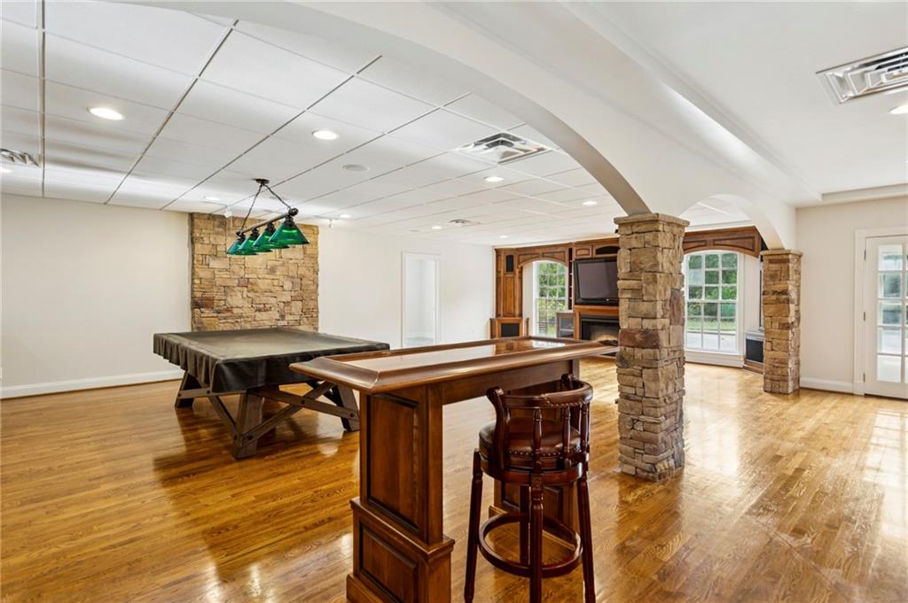 2115 Euharlee Road Taylorsville, GA 30178 - Photo 47 of 66 a kitchen with stainless steel appliances granite countertop a stove a refrigerator and a dining table with wooden floors