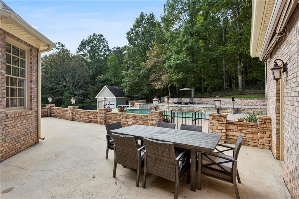 2115 Euharlee Road Taylorsville, GA 30178 - Photo 57 of 66 a backyard of a house with table and chairs