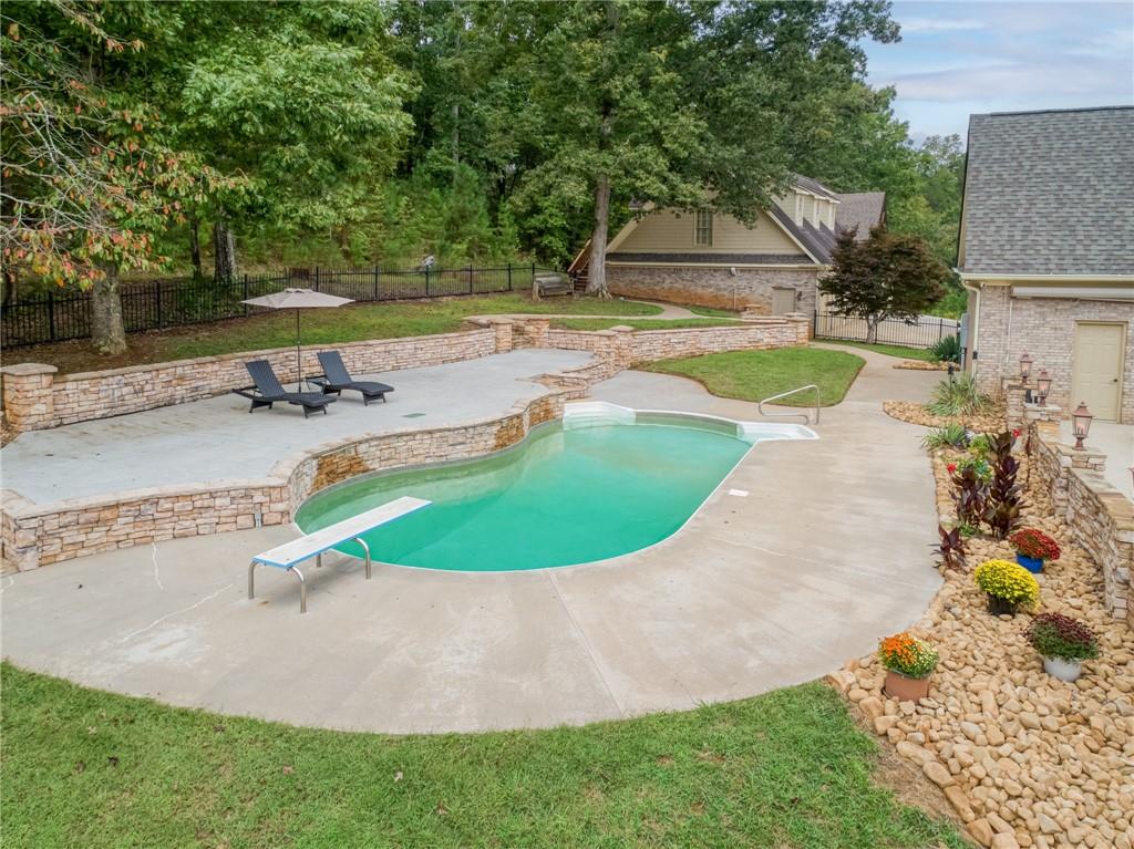 2115 Euharlee Road Taylorsville, GA 30178 - Photo 6 of 66 a view of a swimming pool with a patio