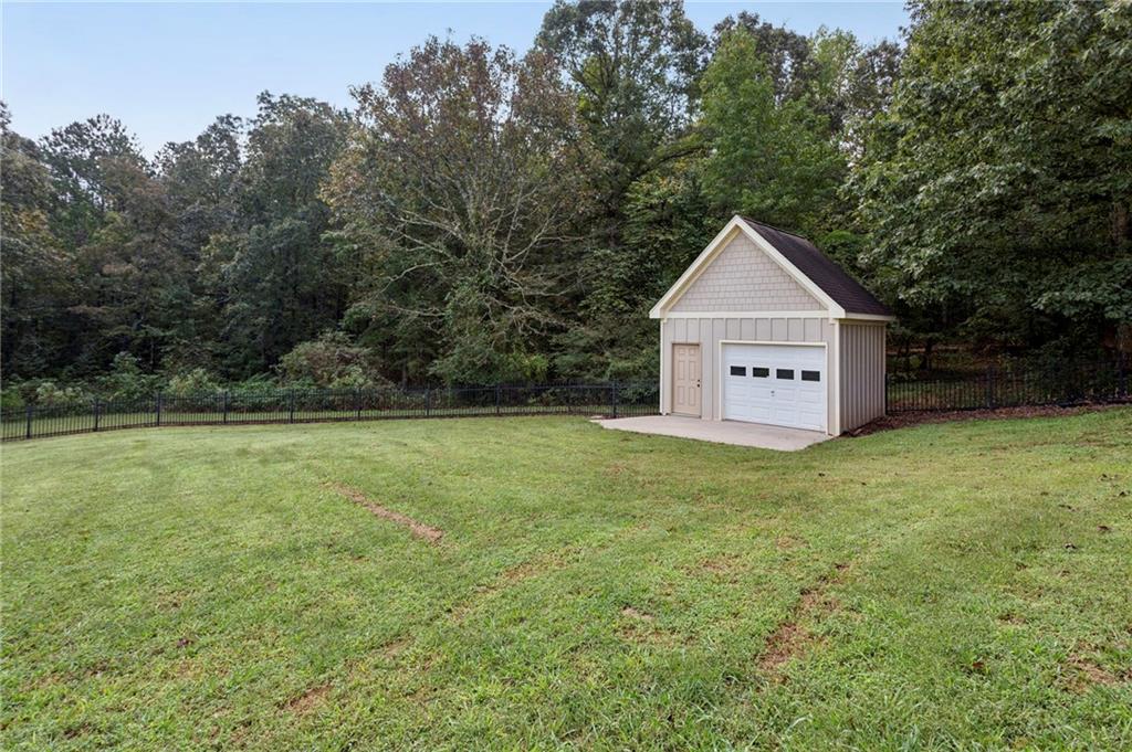 2115 Euharlee Road Taylorsville, GA 30178 - Photo 64 of 66 a view of a house with a yard