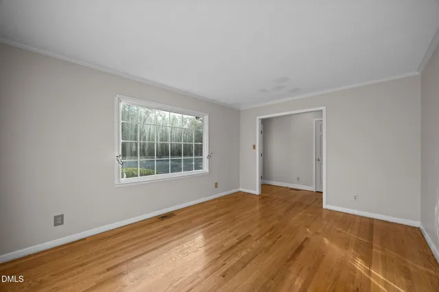 a view of an empty room with a closet