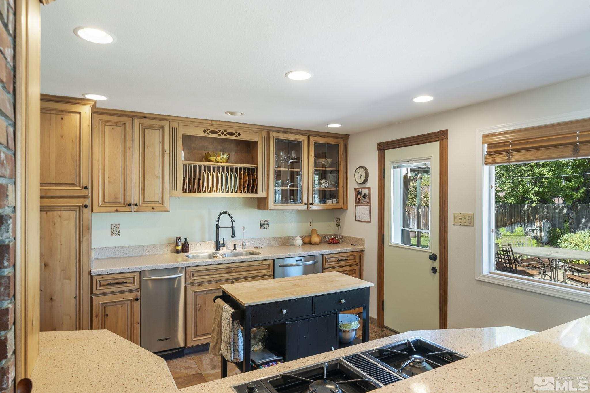 1000 Sumac Street Reno, NV 89509 - Photo 12 of 40 a kitchen with a sink stove and cabinets