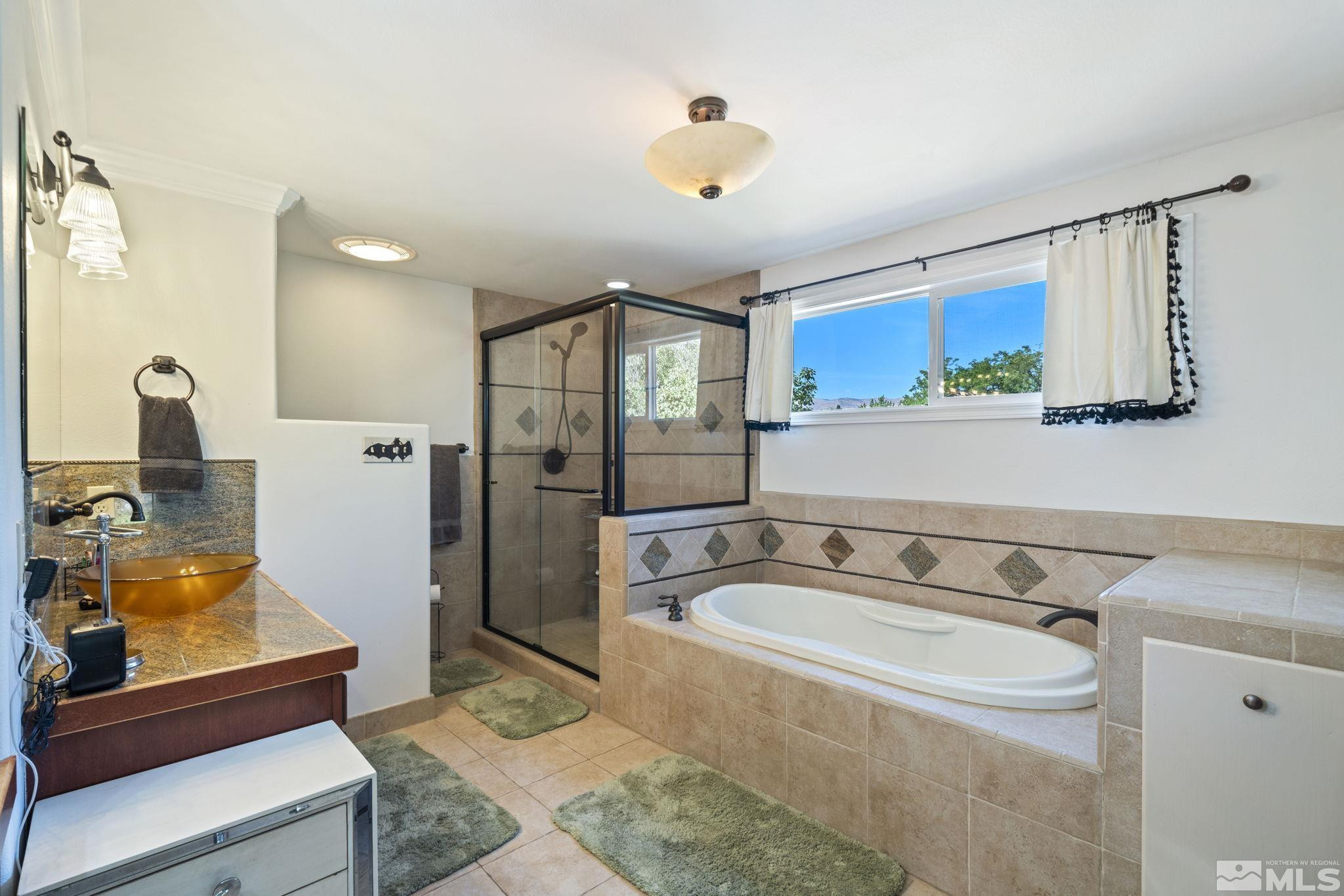 1000 Sumac Street Reno, NV 89509 - Photo 20 of 40 a bathroom with a sink double vanity and a mirror