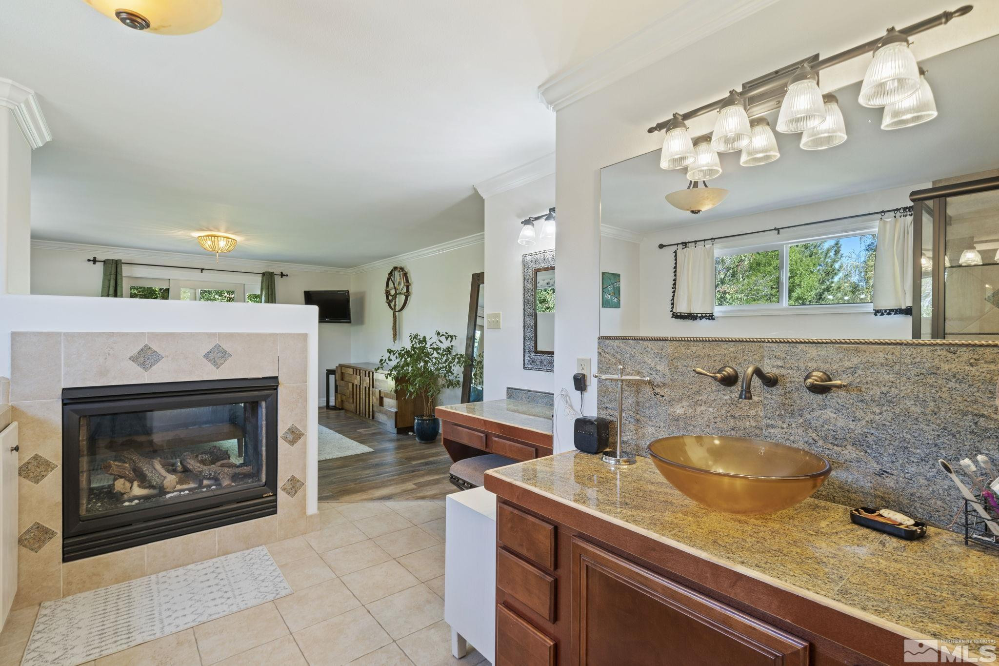 1000 Sumac Street Reno, NV 89509 - Photo 21 of 40 a bathroom with a sink and a mirror