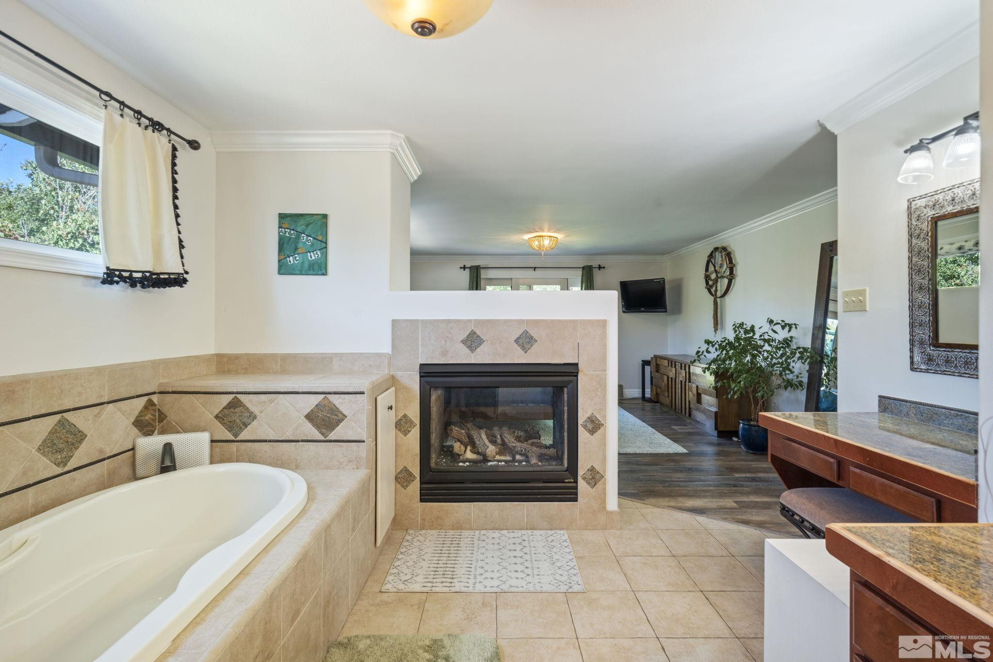 1000 Sumac Street Reno, NV 89509 - Photo 22 of 40 a living room with furniture and a fireplace