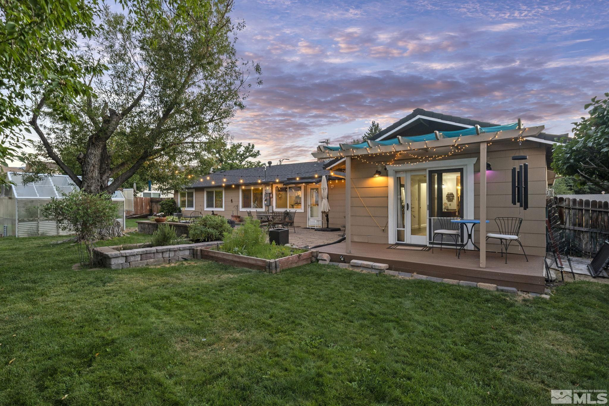 1000 Sumac Street Reno, NV 89509 - Photo 30 of 40 a front view of a house with a yard table and chairs
