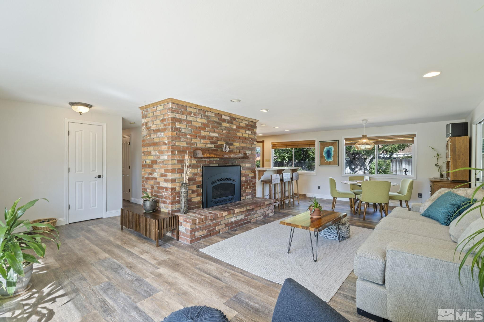 1000 Sumac Street Reno, NV 89509 - Photo 3 of 40 a living room with furniture and a fireplace