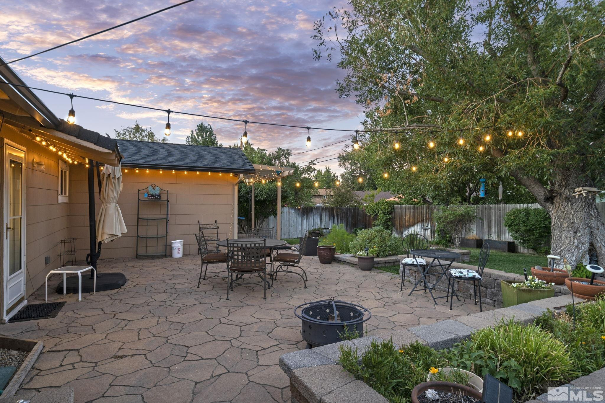 1000 Sumac Street Reno, NV 89509 - Photo 31 of 40 a view of backyard with outdoor seating a patio and plants