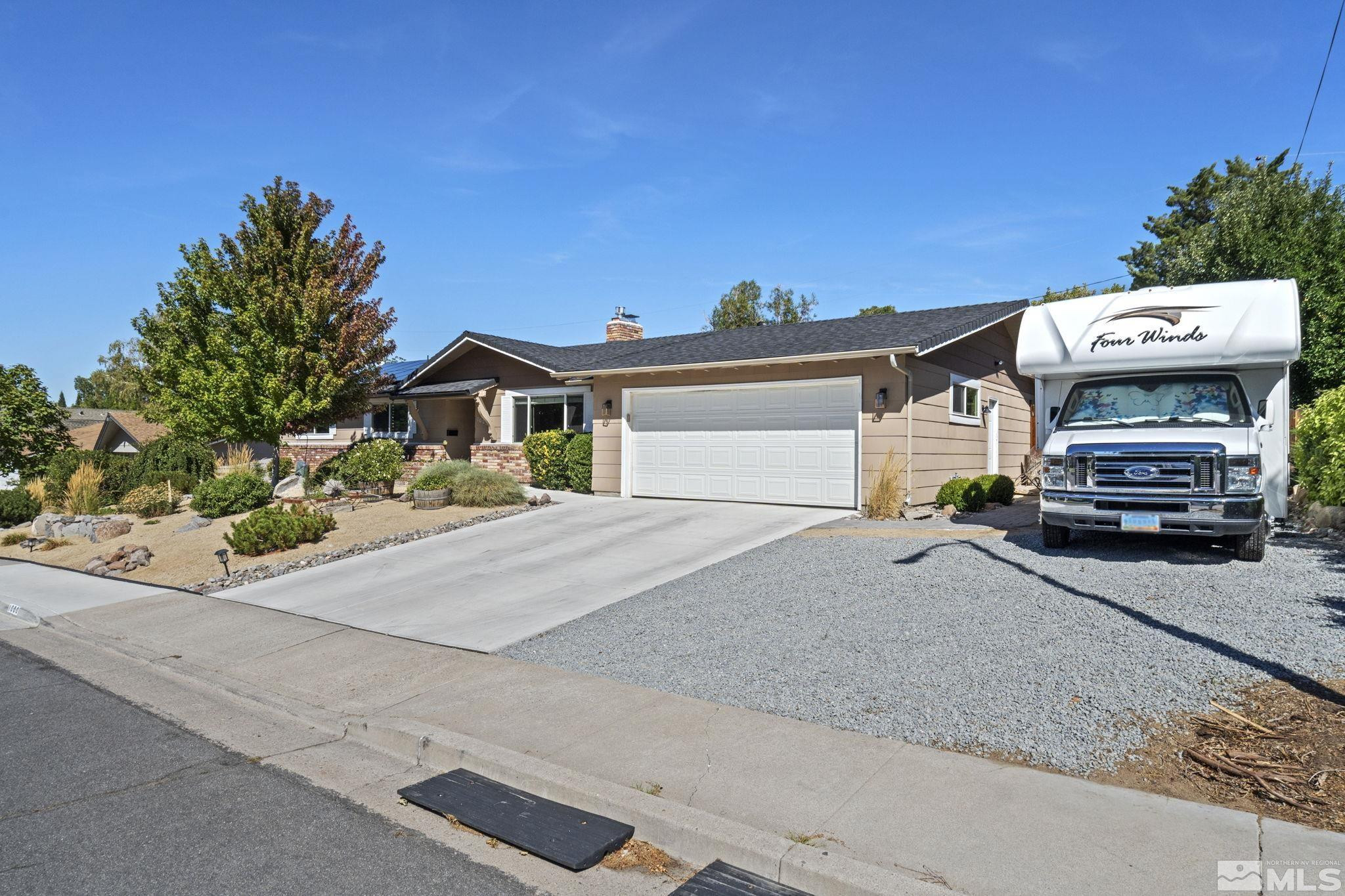 1000 Sumac Street Reno, NV 89509 - Photo 36 of 40 a front view of a house with a garden