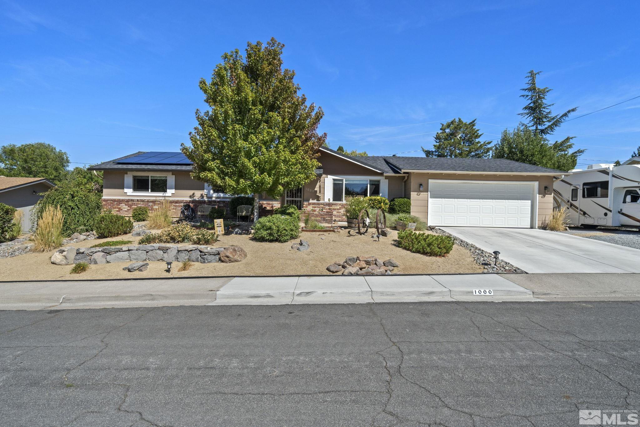 1000 Sumac Street Reno, NV 89509 - Photo 37 of 40 a front view of a house with a garden