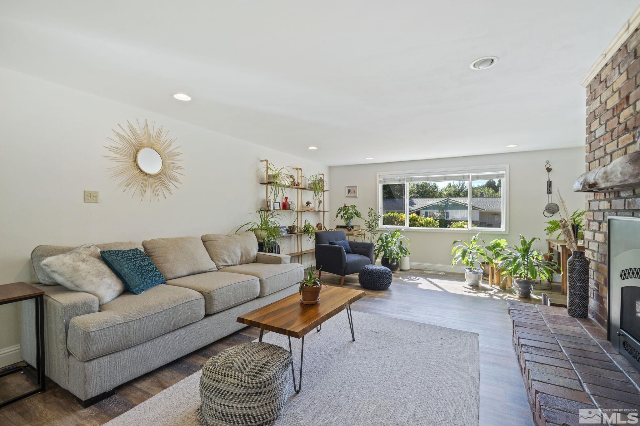 1000 Sumac Street Reno, NV 89509 - Photo 4 of 40 a living room with furniture potted plant and a window