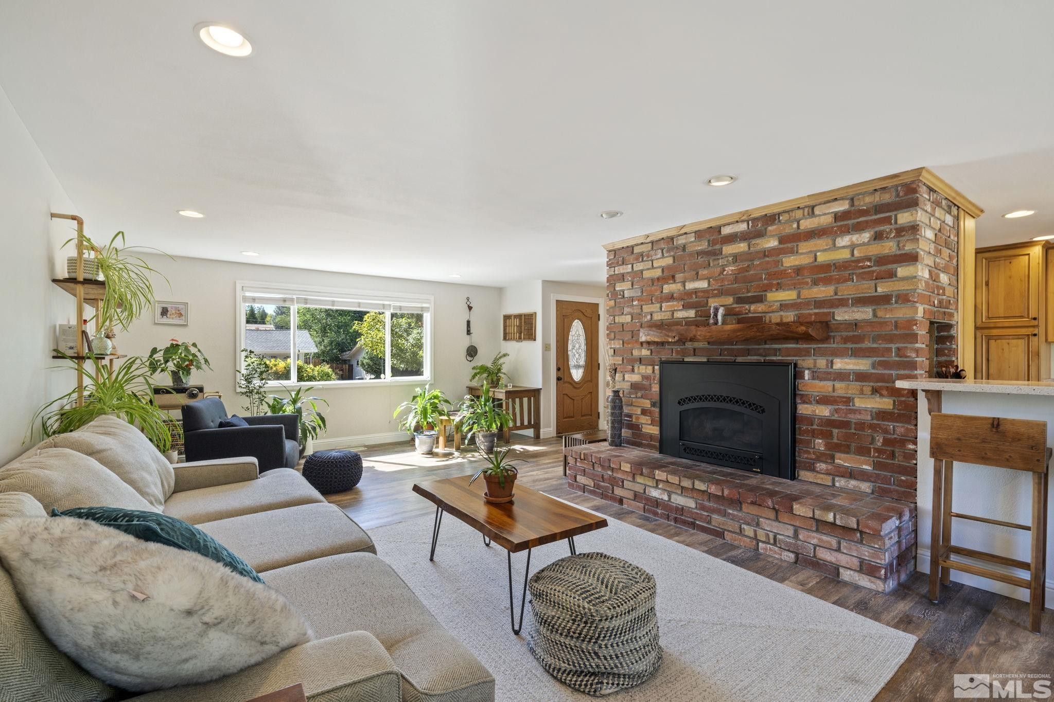 1000 Sumac Street Reno, NV 89509 - Photo 6 of 40 a living room with furniture and a fireplace