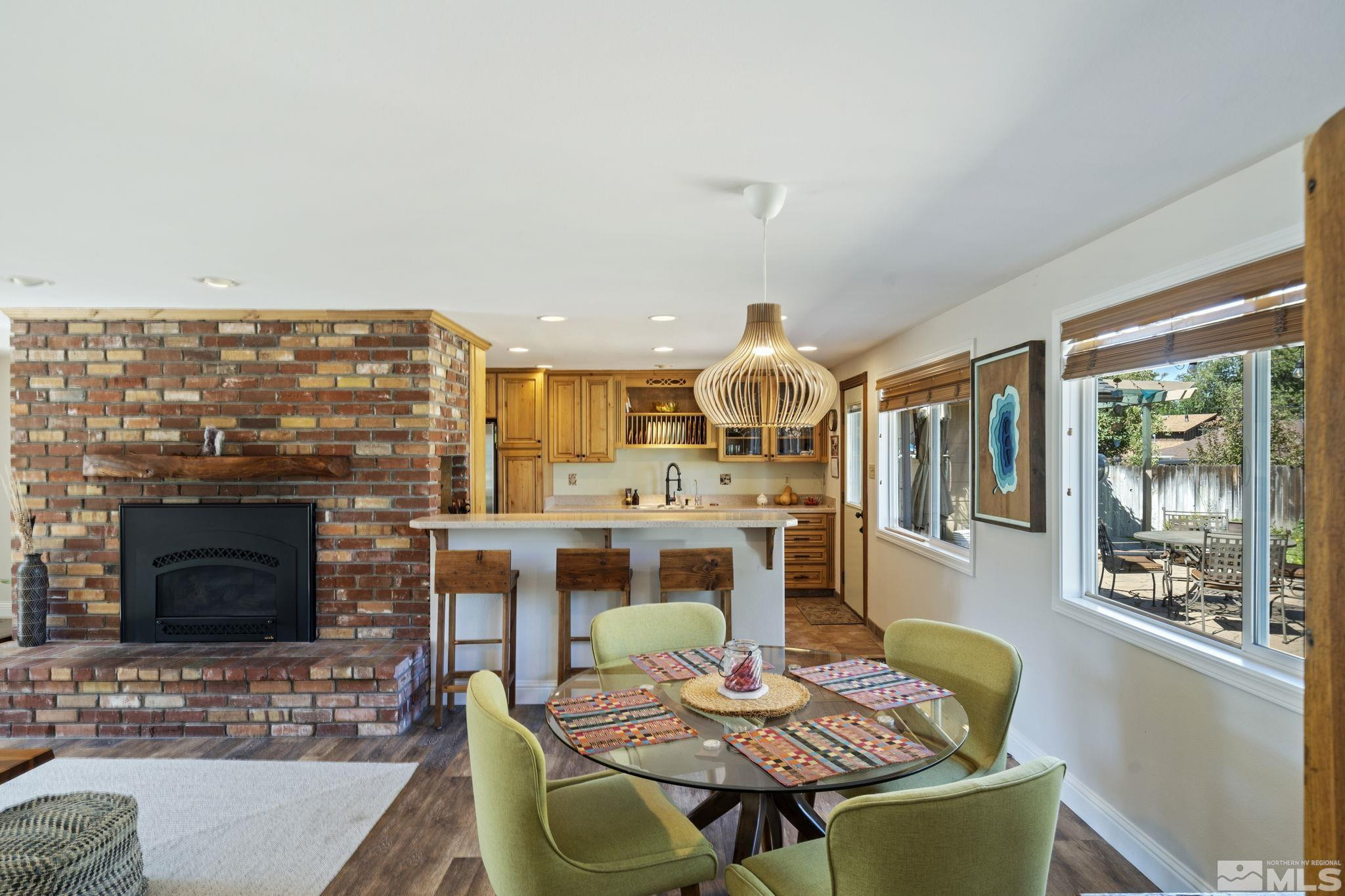 1000 Sumac Street Reno, NV 89509 - Photo 8 of 40 a living room with furniture a fireplace and a flat screen tv