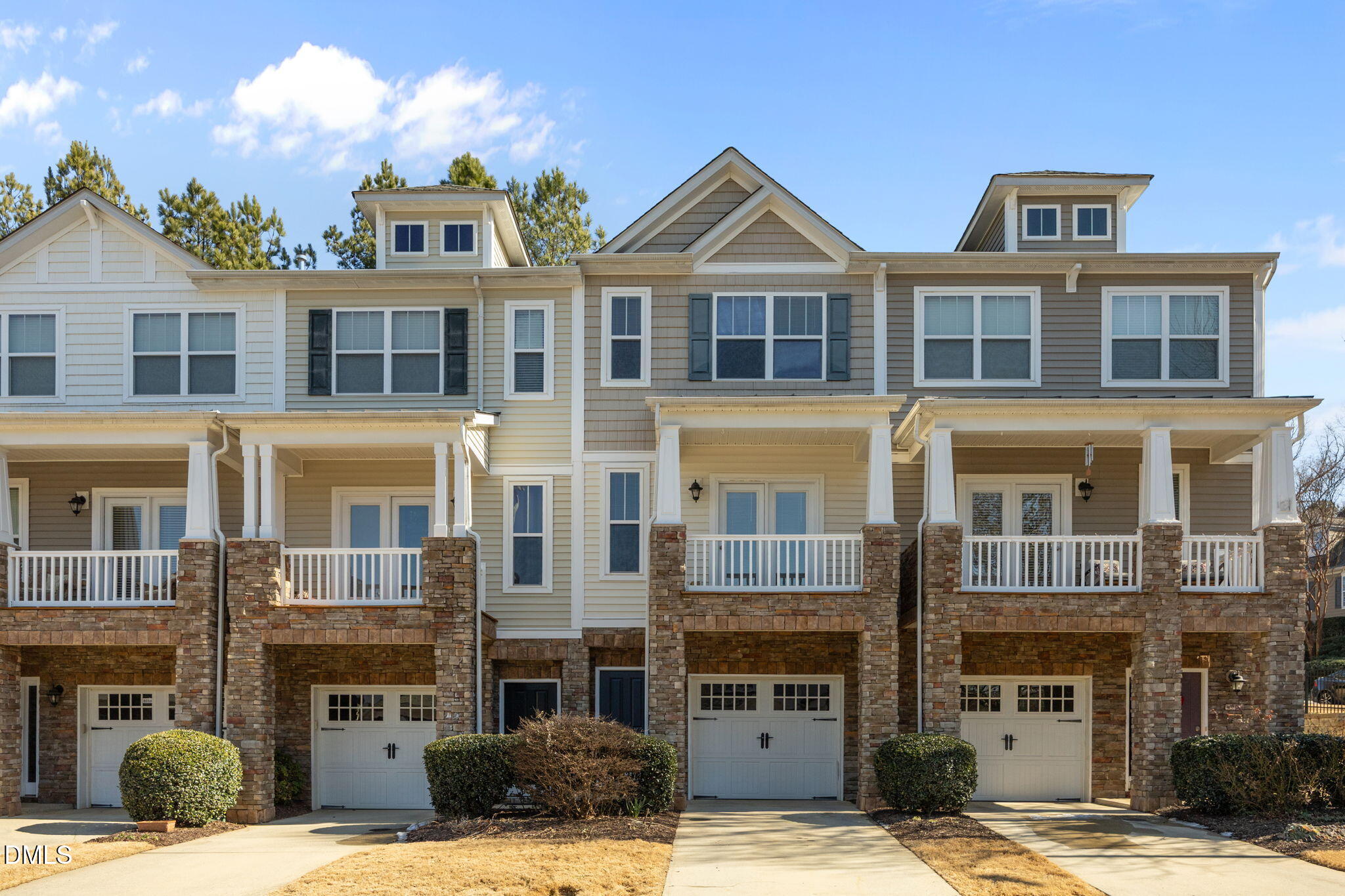 8006 Goldenrain Way Raleigh, NC 27612 - Photo 1 of 40 a front view of a residential apartment building with a yard