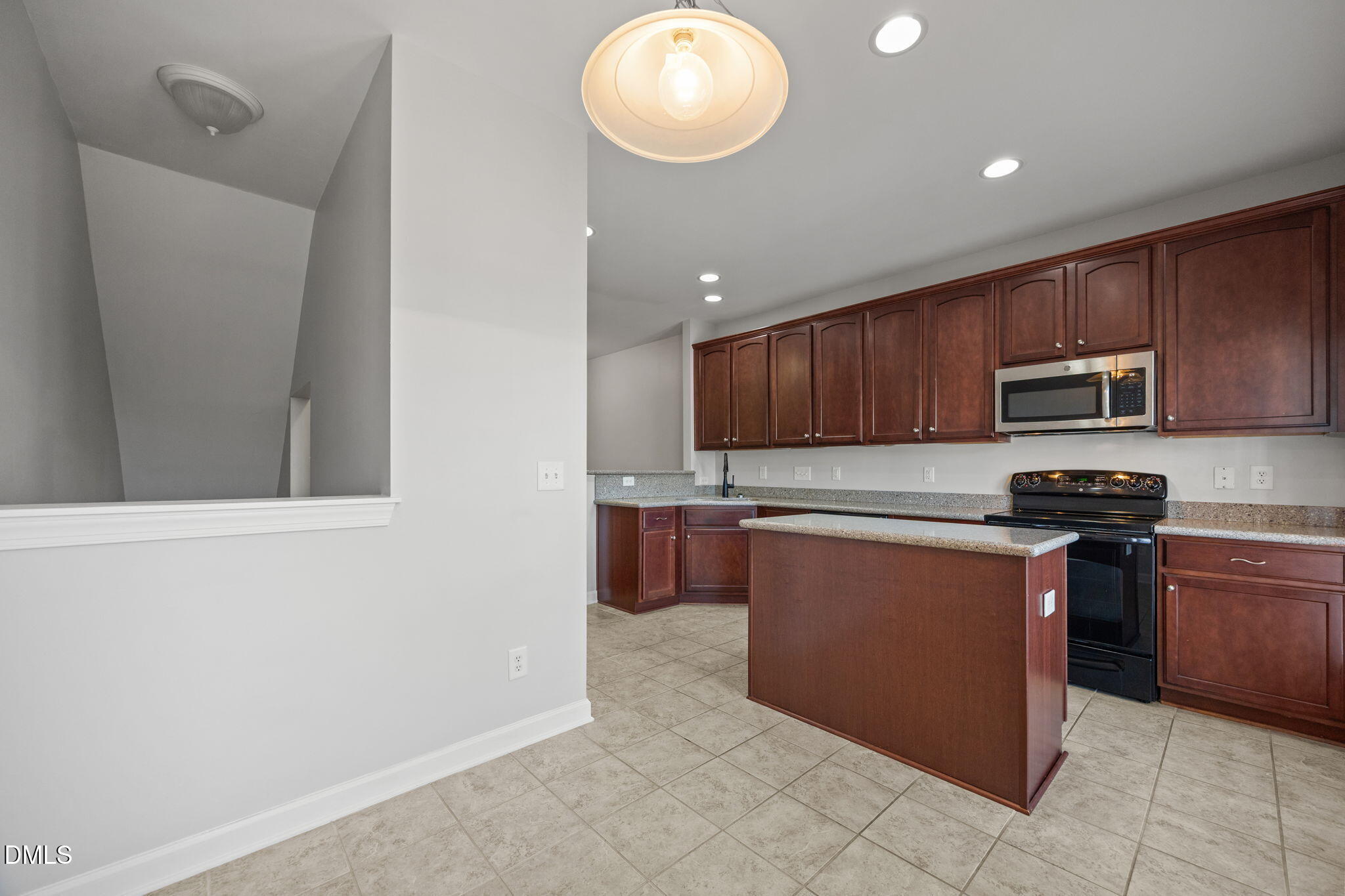 8006 Goldenrain Way Raleigh, NC 27612 - Photo 15 of 40 a kitchen with stainless steel appliances granite countertop a refrigerator a stove top oven and a sink