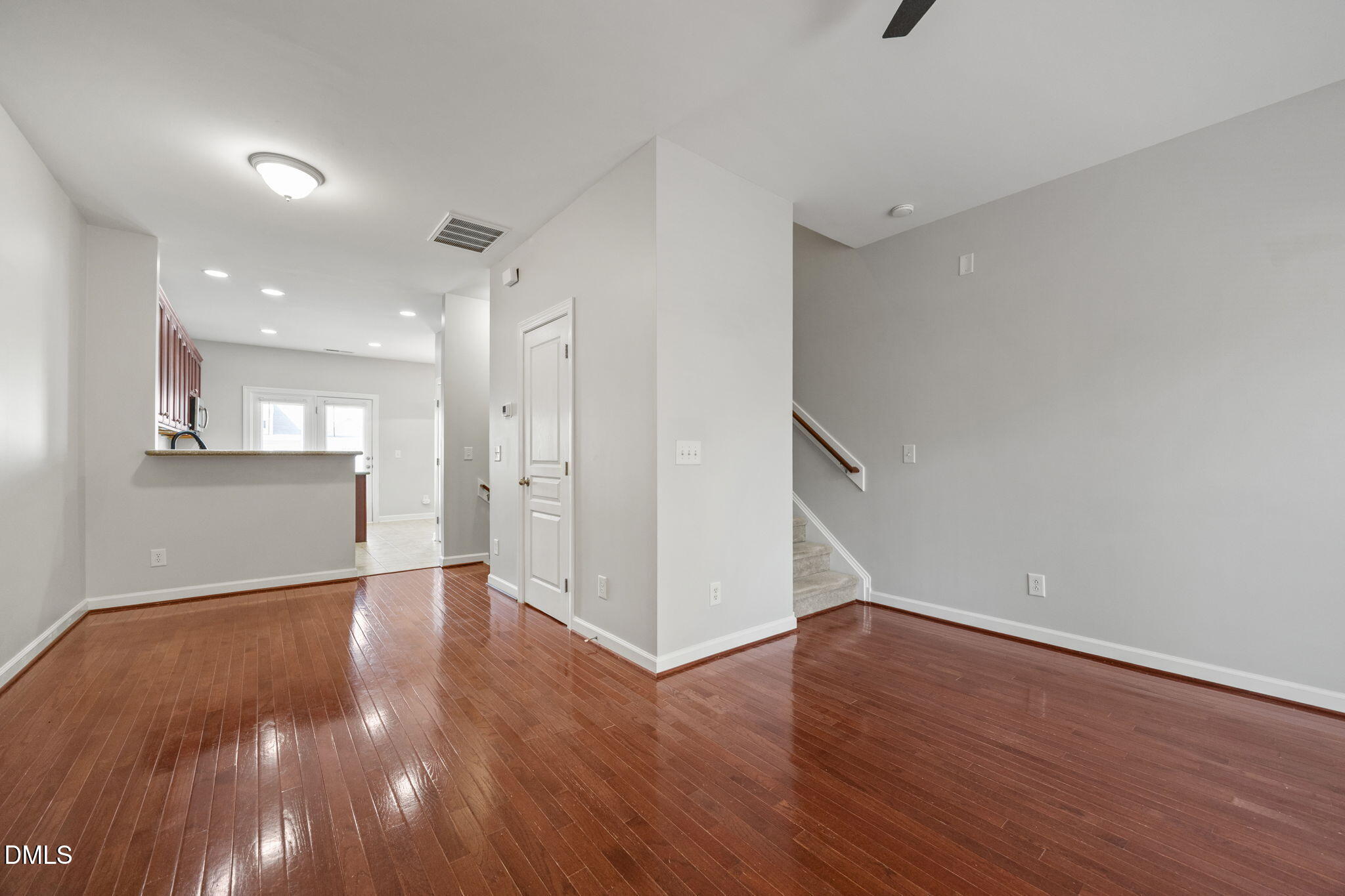 8006 Goldenrain Way Raleigh, NC 27612 - Photo 20 of 40 a view of a kitchen with wooden floor and a sink