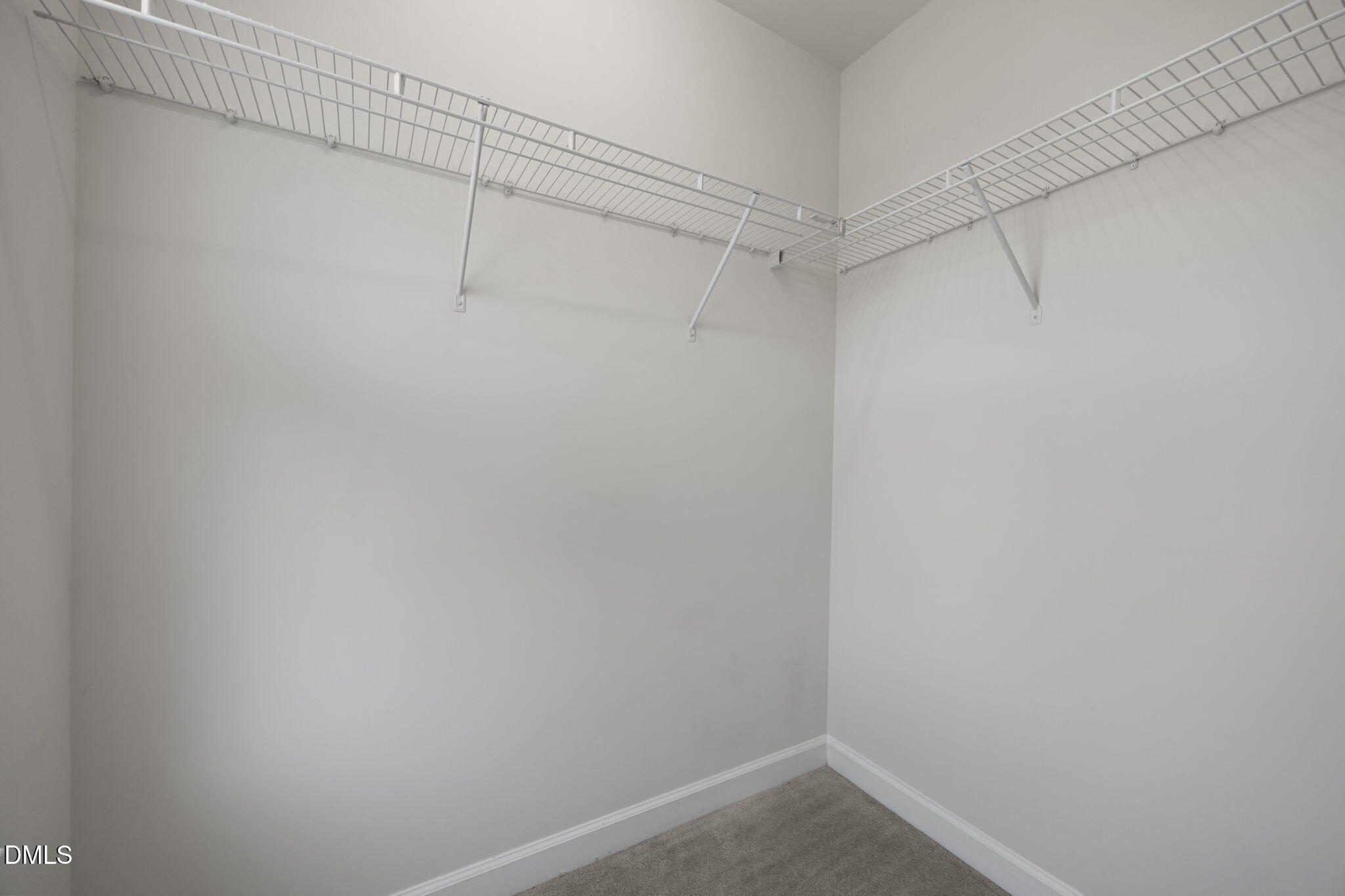8006 Goldenrain Way Raleigh, NC 27612 - Photo 25 of 40 a view of a room with racks on the wall
