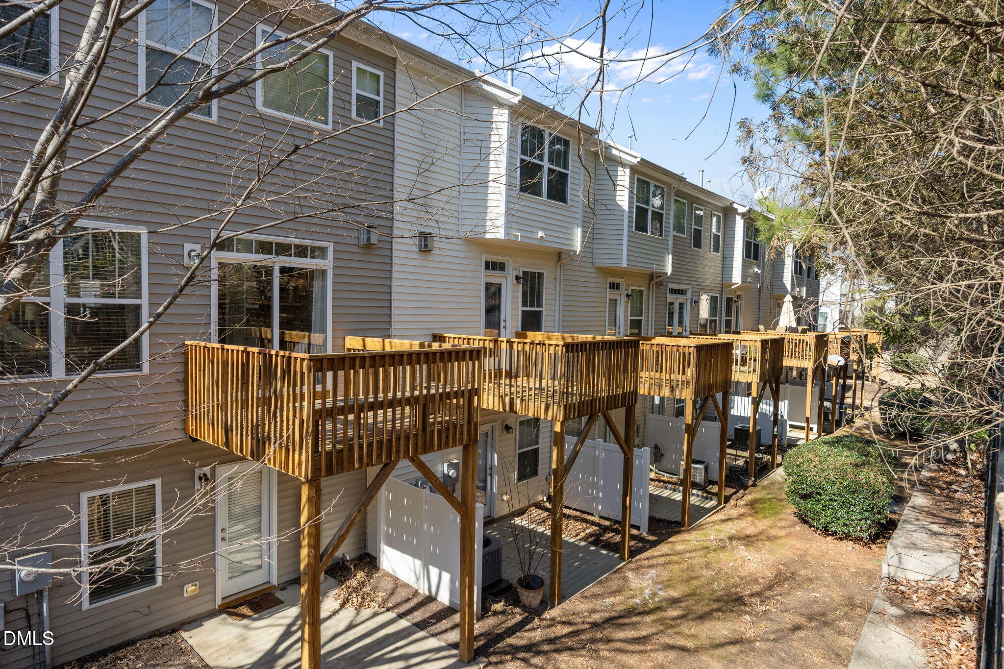 8006 Goldenrain Way Raleigh, NC 27612 - Photo 35 of 40 a view of a house with wooden deck front of house