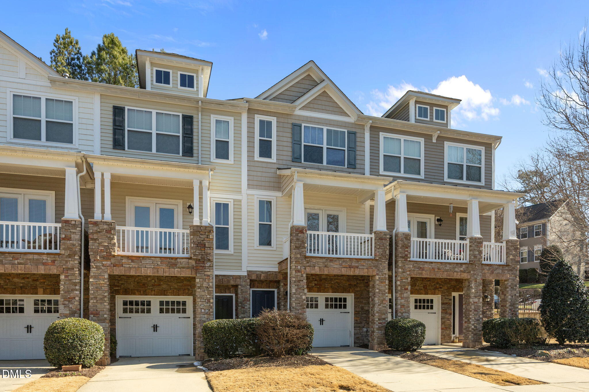8006 Goldenrain Way Raleigh, NC 27612 - Photo 39 of 40 a front view of a residential apartment building with a yard