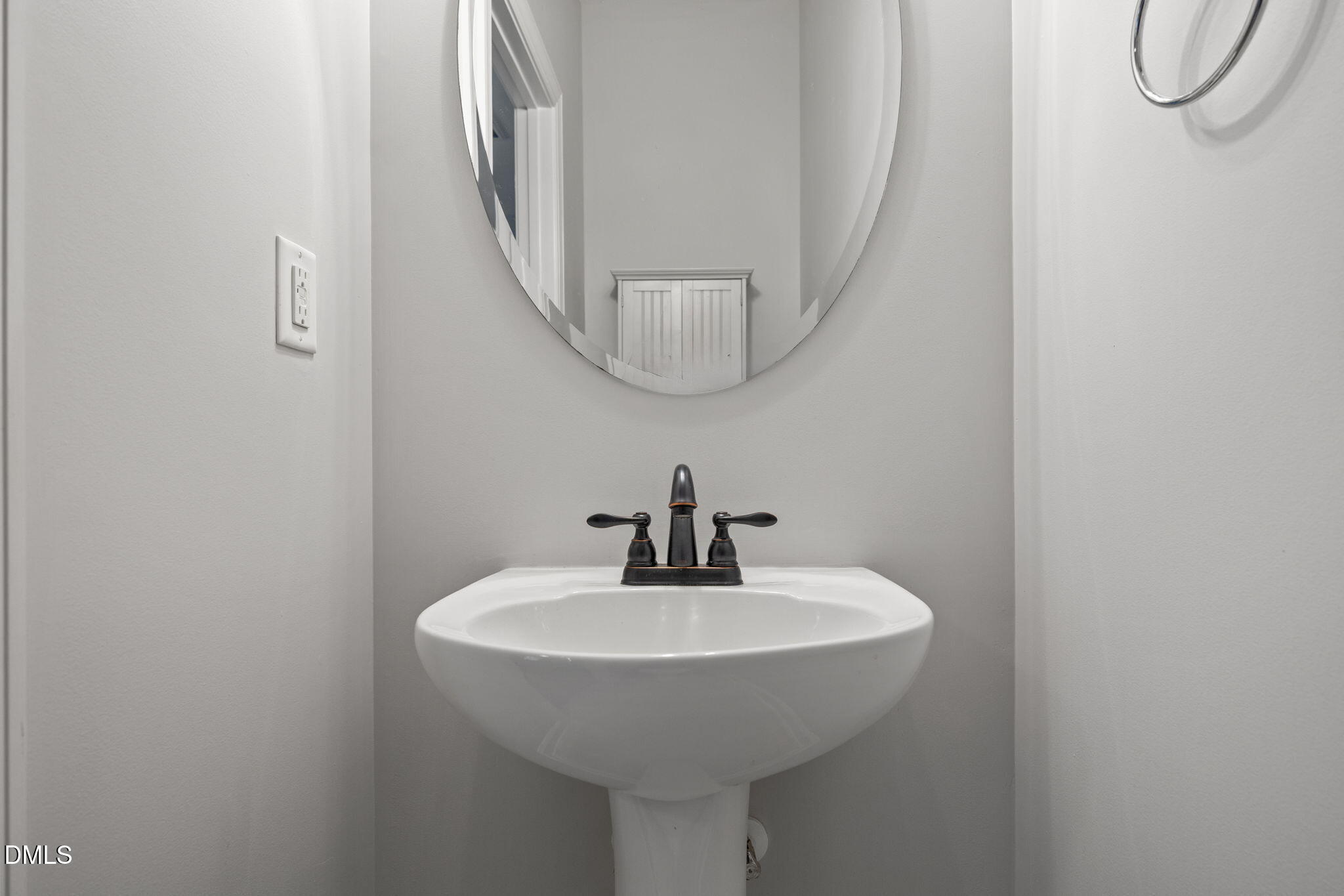 8006 Goldenrain Way Raleigh, NC 27612 - Photo 7 of 40 a bathroom with a sink and a mirror