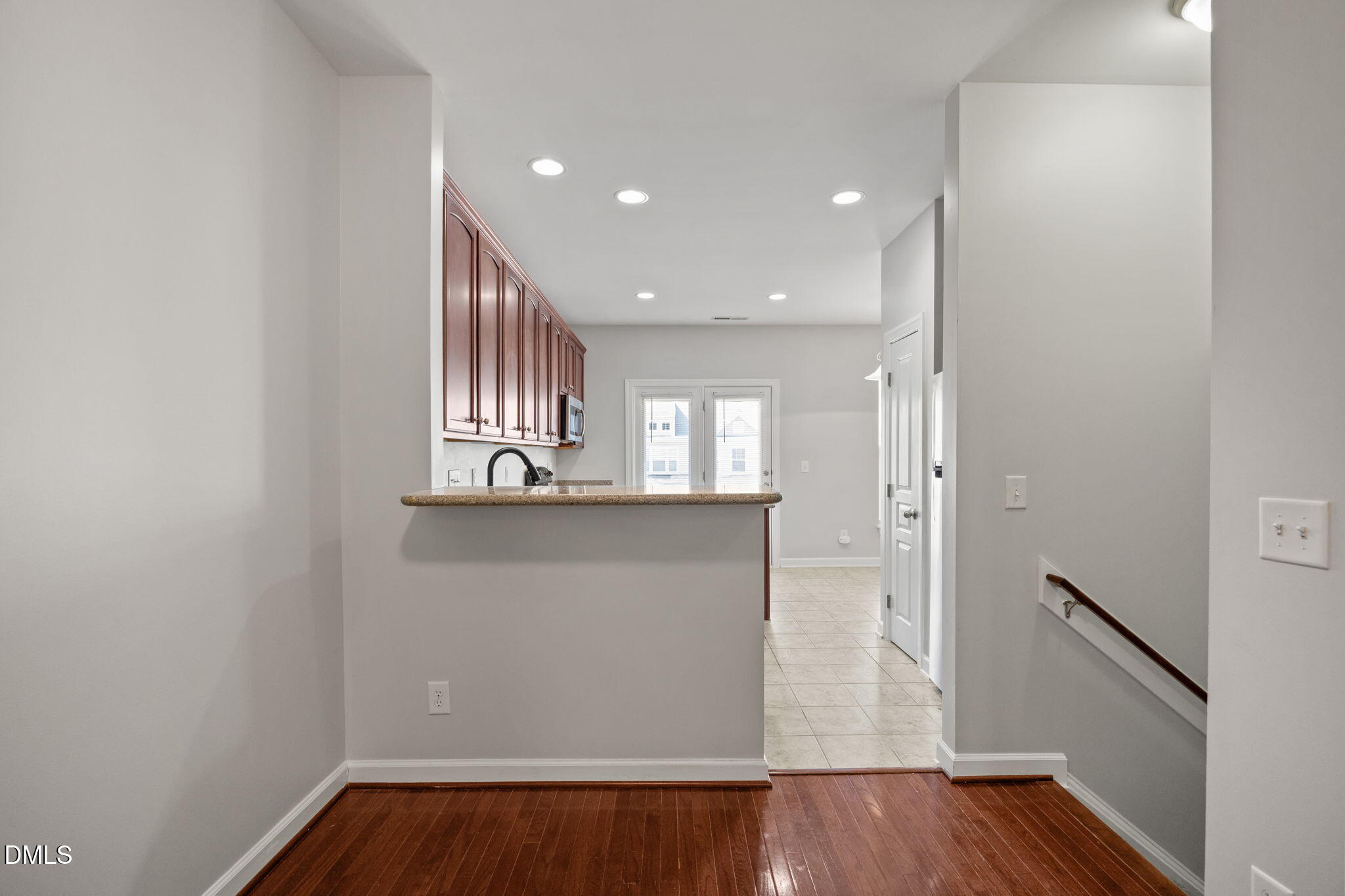 8006 Goldenrain Way Raleigh, NC 27612 - Photo 8 of 40 a view of kitchen with wooden floor and electronic appliances