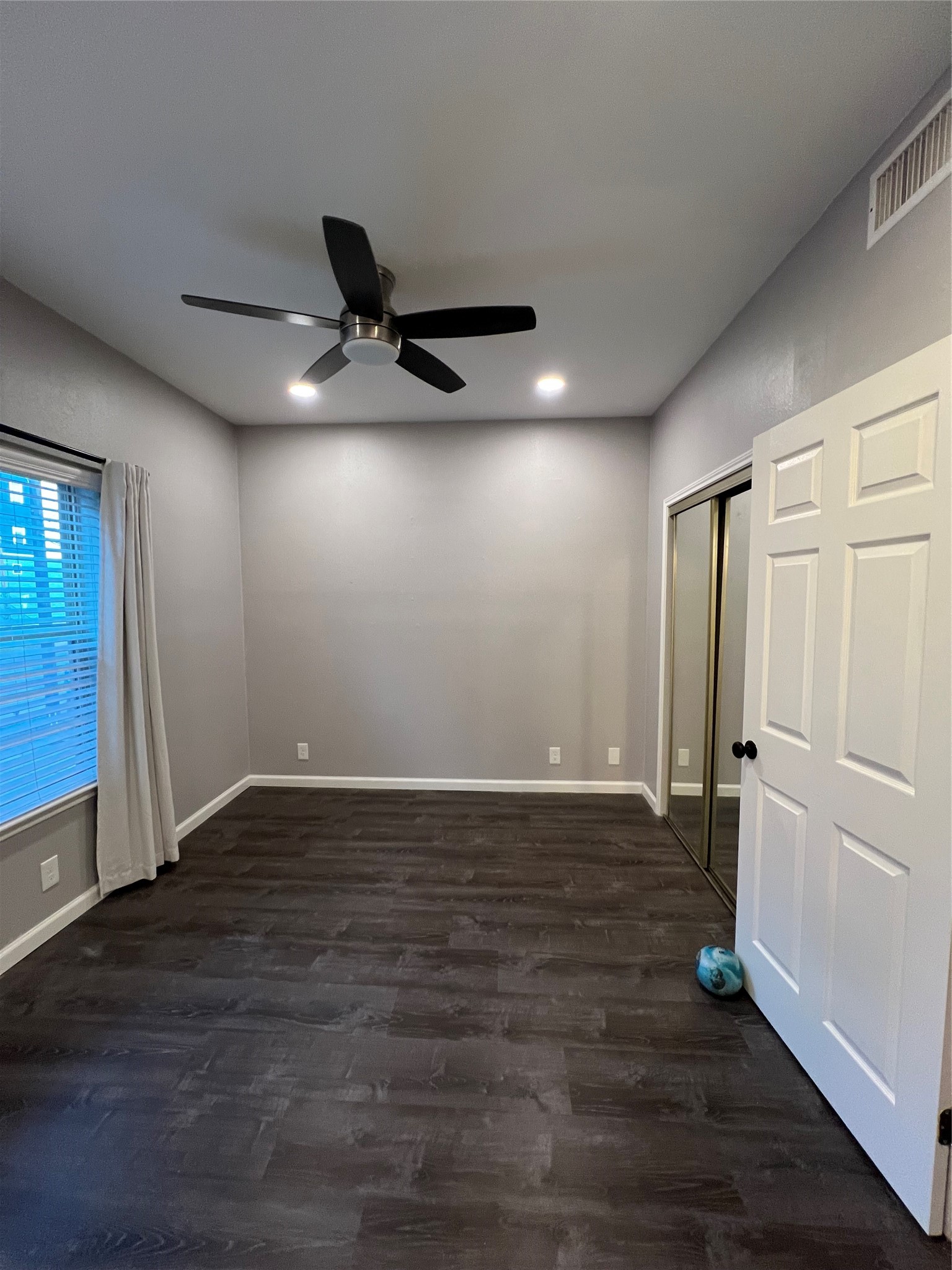 2414 Longview Street, Unit 202 Austin, TX 78705 - Photo 10 of 17 Spacious primary bedroom with
beautiful flooring and ceiling fan.