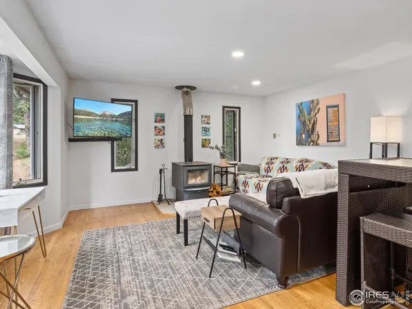 a living room with furniture and a rug