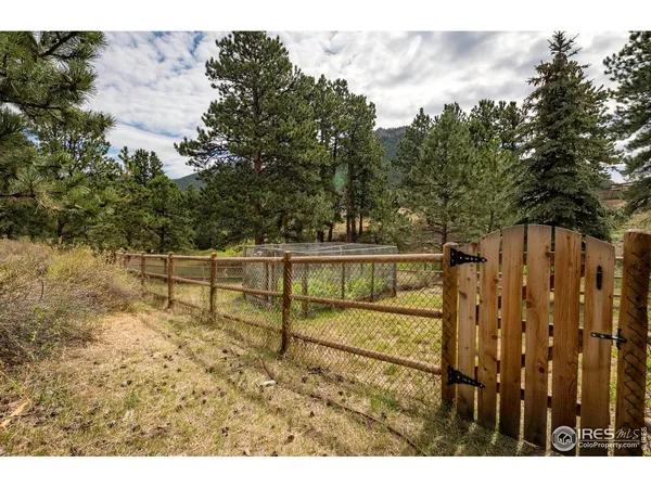 a view of a wooden fence