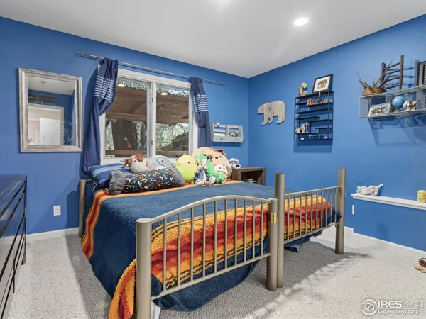 a bedroom with furniture and a window