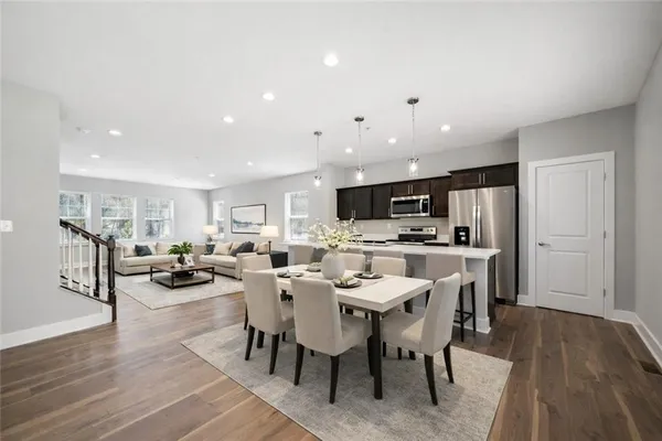 a view of a dining area with furniture and wooden floor