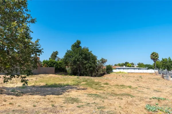 a view of ocean with a big yard