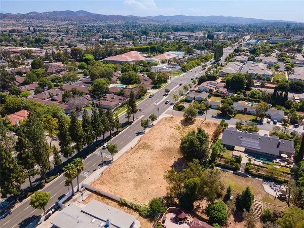 an aerial view of residential houses and outdoor space