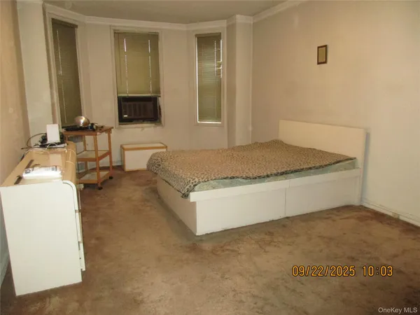 a spacious bathroom with a granite countertop sink and a mirror