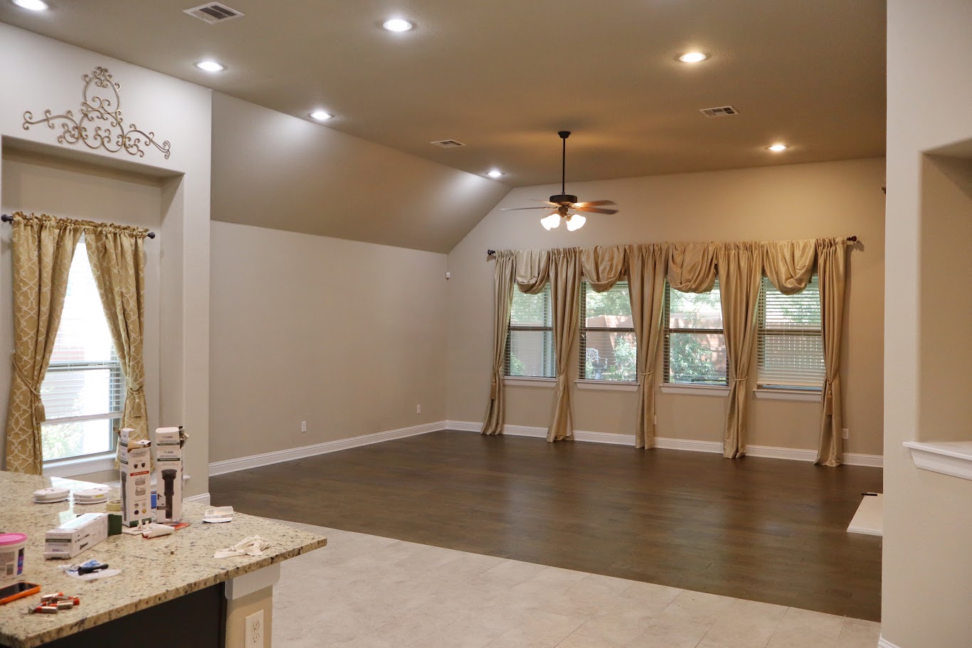 1509 Highland Ridge Road Georgetown, TX 78628 - Photo 17 of 28 An open-concept living area features a warm color palette, ample natural light, and varied flooring.