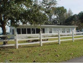 20383 1st Street McIntosh, FL 32664 - Photo 1 of 1 a house view with a garden space