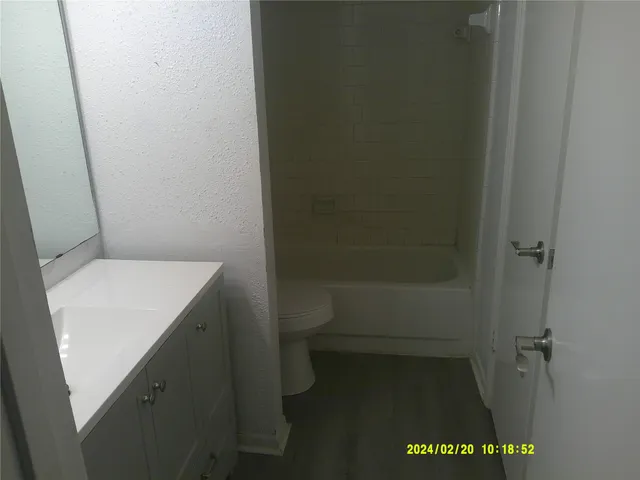a bathroom with a toilet and a sink
