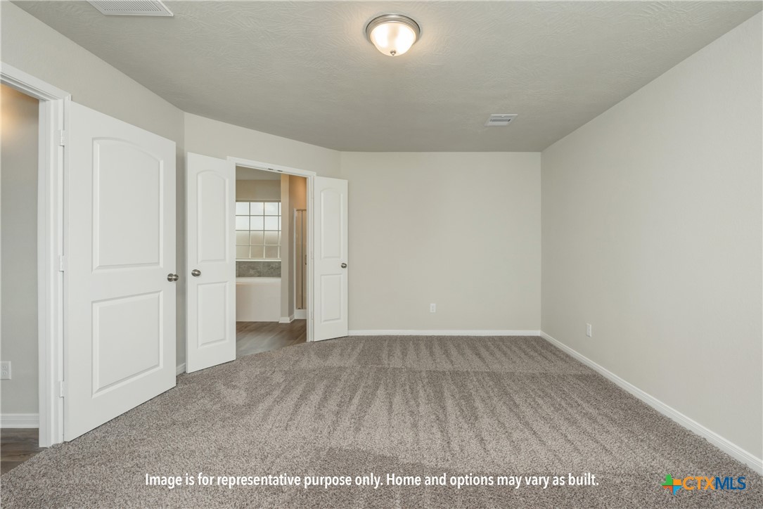 2023 Filmore Cove Temple, TX 76504 - Photo 7 of 9 an empty room with wooden floor and windows
