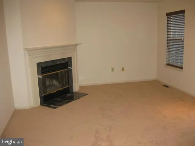 a living room with a fireplace