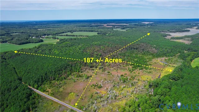 a view of a green field with an outdoor space