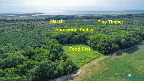 a view of a sign board with a garden