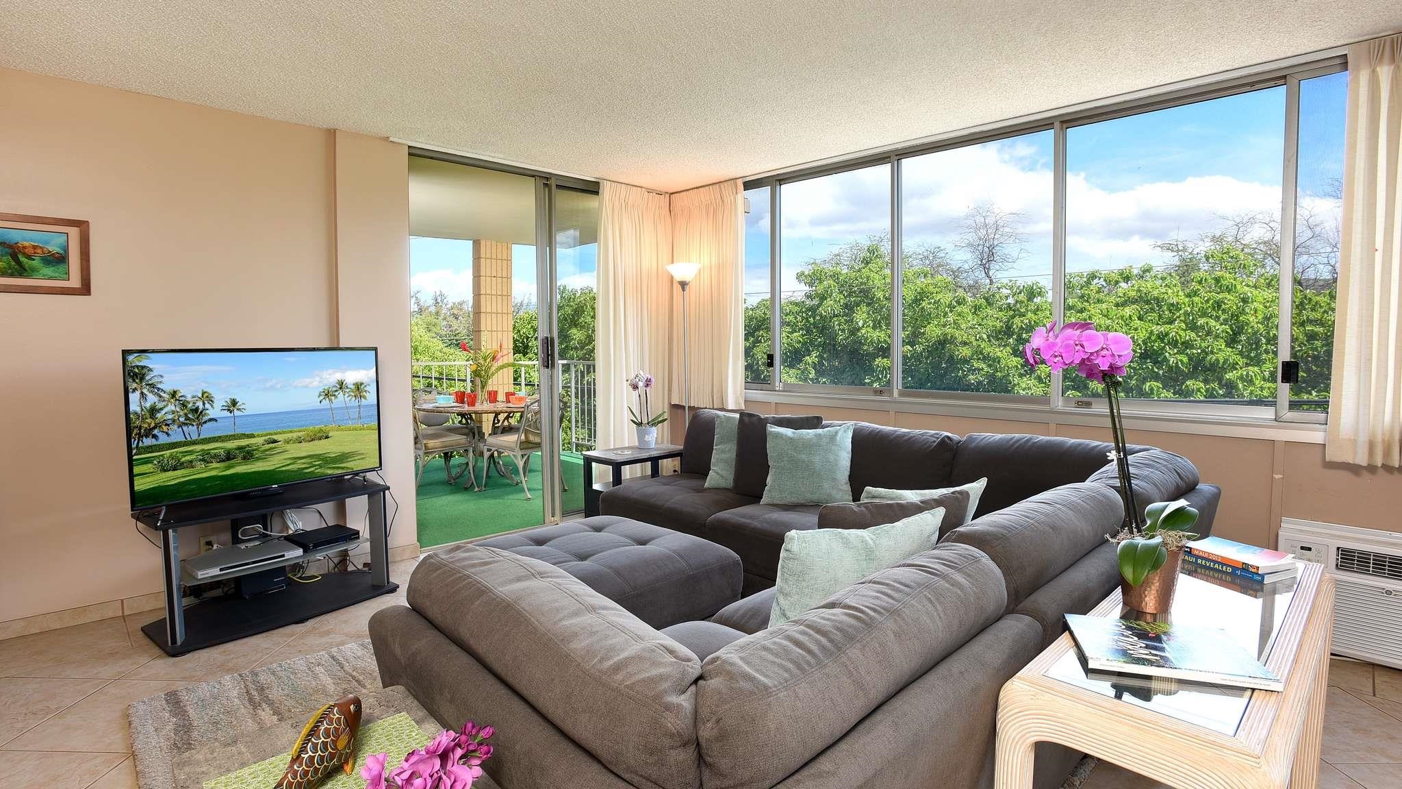2619 South Kihei Road, Unit 309A Kihei, HI 96753 - Photo 1 of 41 a living room with furniture and a flat screen tv