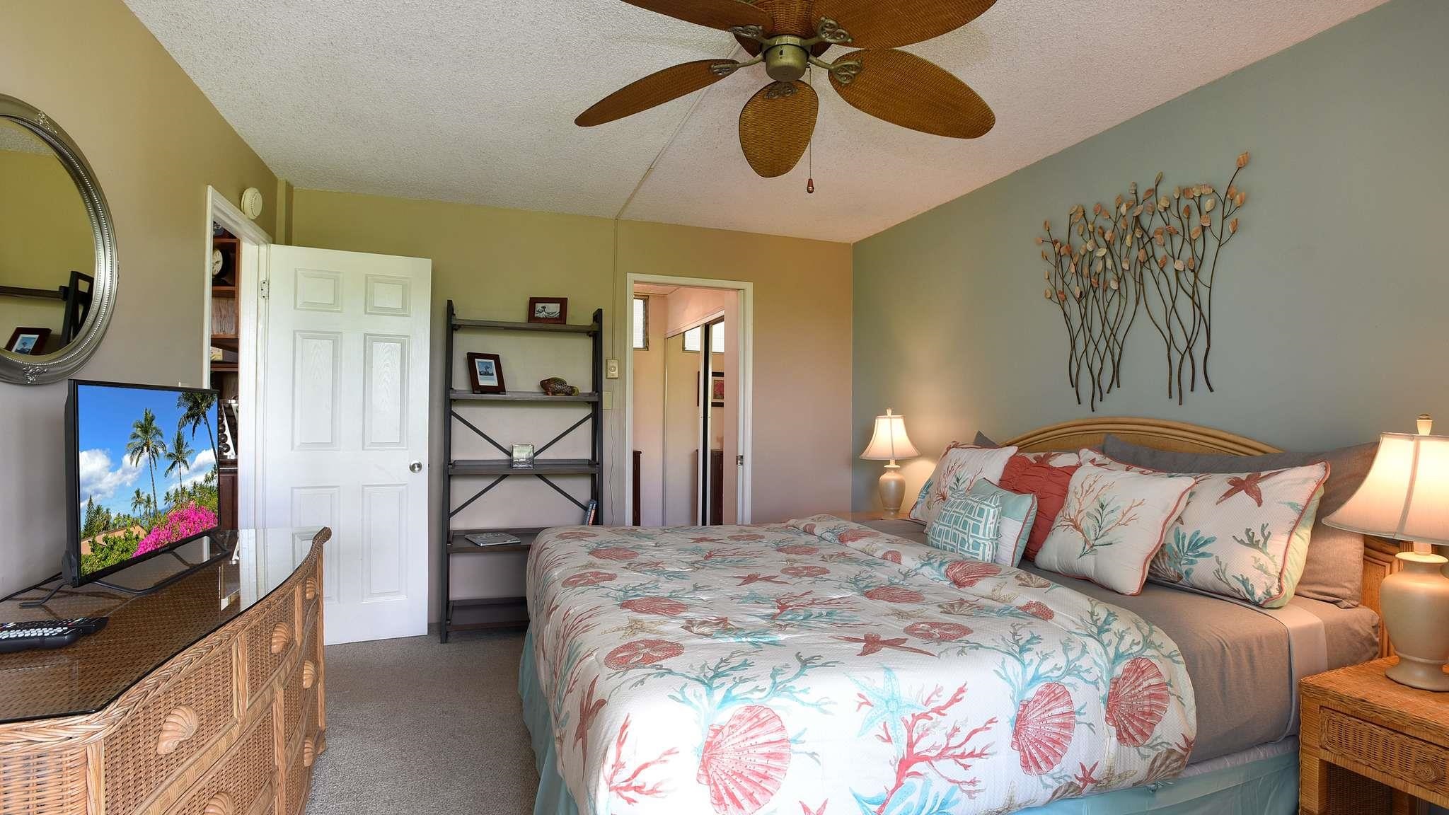 2619 South Kihei Road, Unit 309A Kihei, HI 96753 - Photo 14 of 41 a bedroom with a bed and a flat tv screen on dresser
