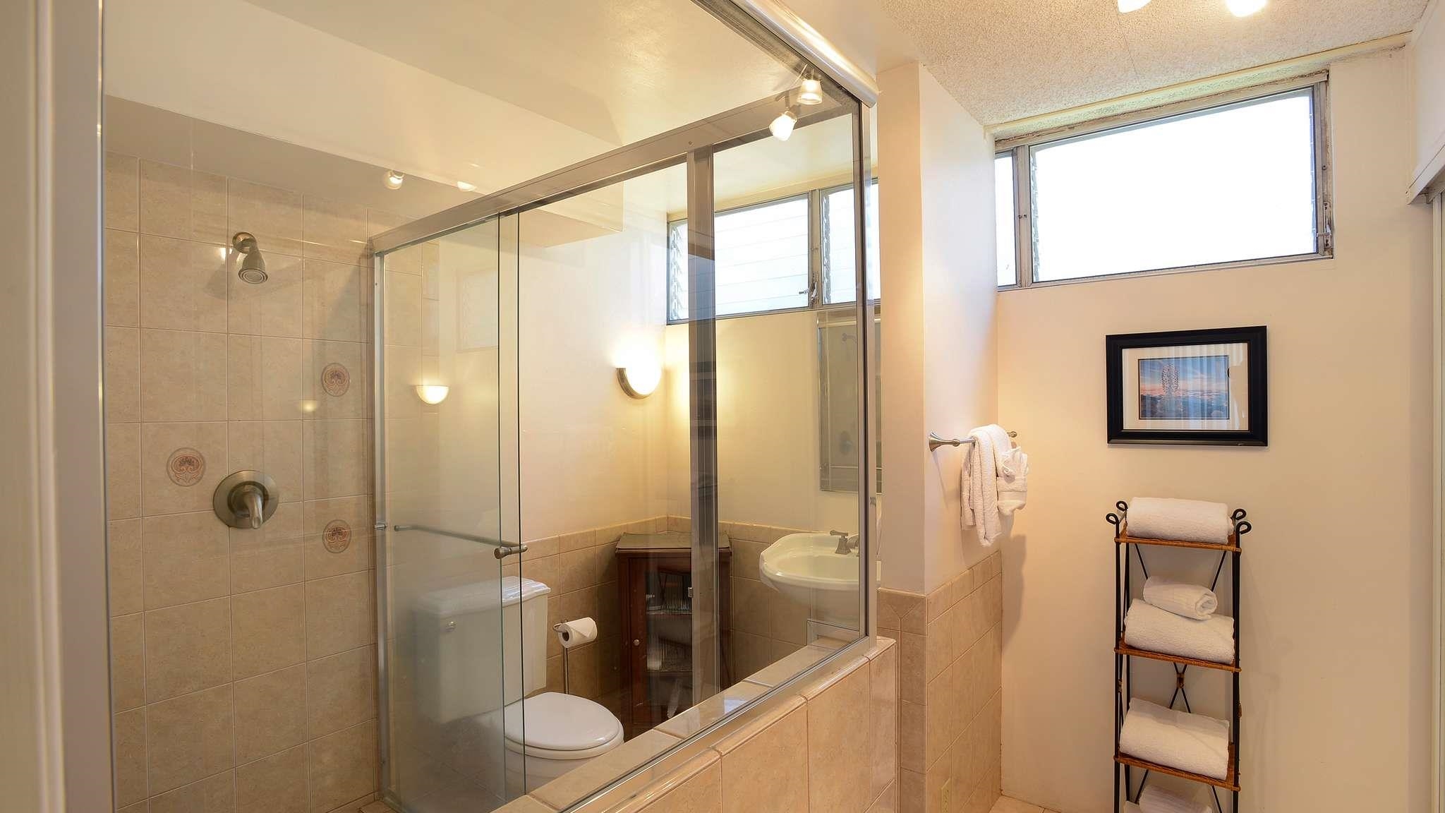 2619 South Kihei Road, Unit 309A Kihei, HI 96753 - Photo 15 of 41 a bathroom with a glass shower door and a sink