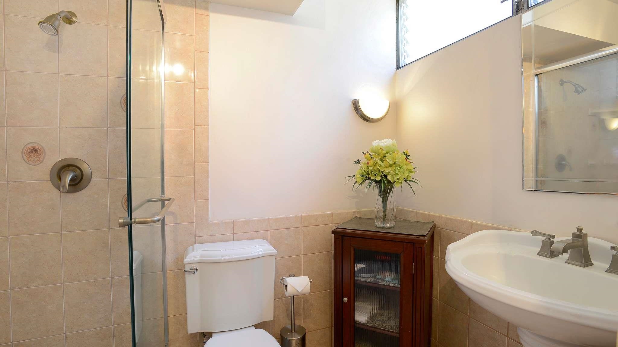 2619 South Kihei Road, Unit 309A Kihei, HI 96753 - Photo 17 of 41 a bathroom with a sink a toilet and mirror