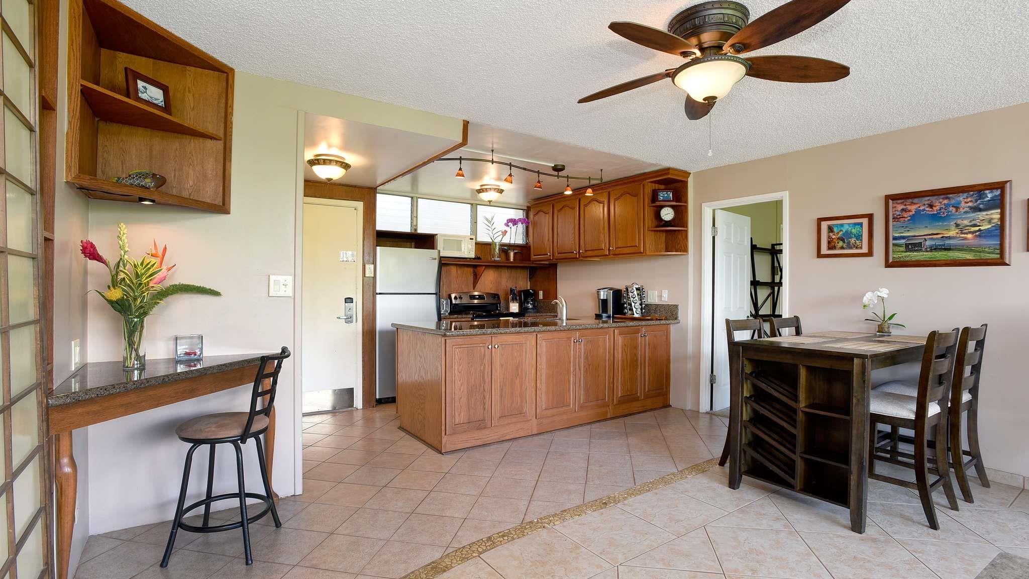 2619 South Kihei Road, Unit 309A Kihei, HI 96753 - Photo 2 of 41 a view of a dining room with furniture and a kitchen